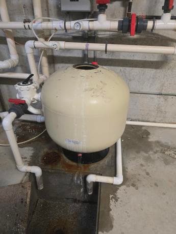 Pool filter tank and pipe system installed by Calgary plumber